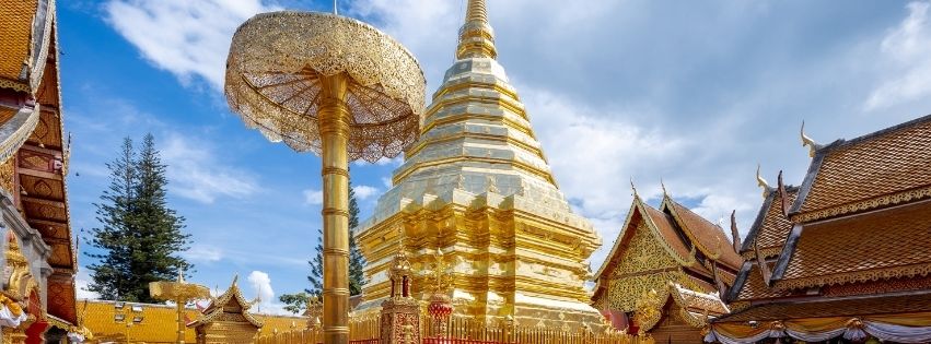 tour chiang mai, Doi Suthep Temple at sunset, a famous tourist attraction in Chiang Mai, Thailand, with golden pagodas and scenic mountain views.